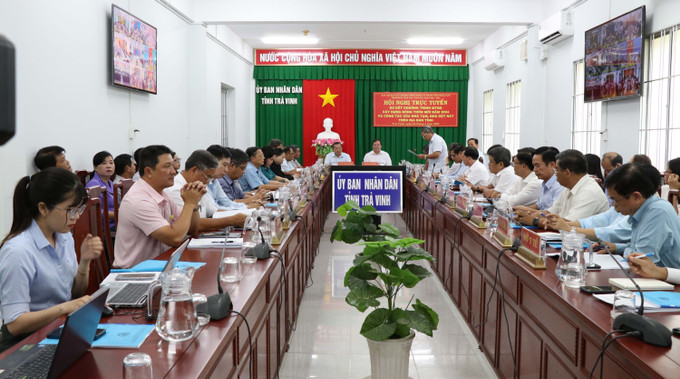 Quang cảnh hội nghị. Ảnh: Thanh Hòa - TTXVN potal-tra-vinh-so-ket-chuong-trinh-xay-dung-nong-thon-moi-va-xoa-nha-tam-nha-dot-nat-7954365.jpg