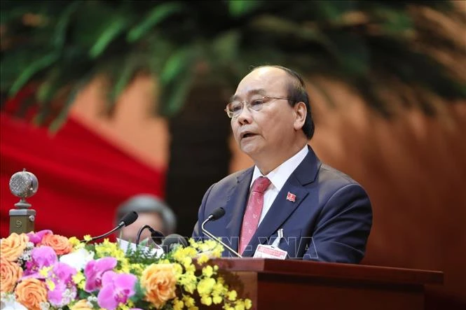 Đồng chí Nguyễn Xuân Phúc, Uỷ viên Bộ Chính trị, Thủ tướng Chính phủ thay mặt Đoàn Chủ tịch đọc Diễn văn khai mạc Đại hội. Ảnh: TTXVN