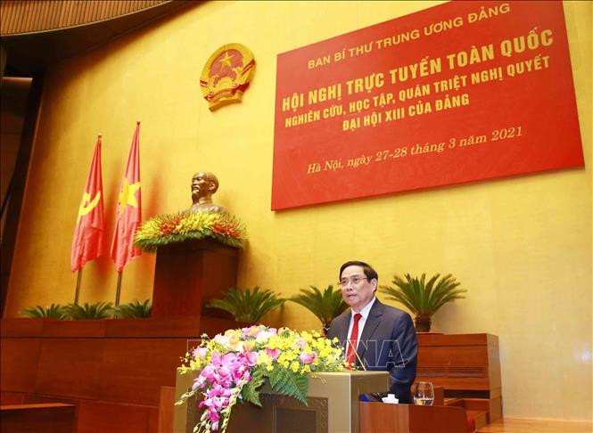 Trưởng Ban Tổ chức Trung ương Phạm Minh Chính giới thiệu, quán triệt chuyên đề: “Báo cáo tổng kết công tác xây dựng Đảng và thi hành Điều lệ Đảng của BCHTƯ khoá XII tại Đại hội XIII của Đảng”. Ảnh: Phương Hoa - TTXVN