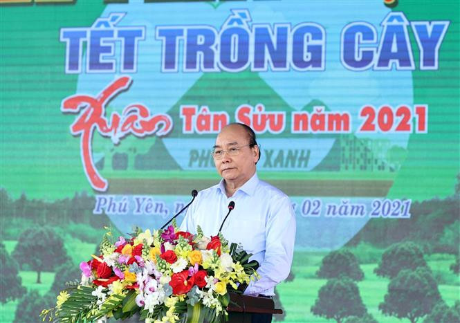 Thủ tướng Nguyễn Xuân Phúc phát biểu tại lễ phát động "Tết trồng cây" Xuân Tân Sửu năm 2021. Ảnh: Thống Nhất - TTXVN Thủ tướng Nguyễn Xuân Phúc dự lễ phát động Tết trồng cây đời đời nhớ ơn Bác Hồ tại Phú Yên ảnh 1