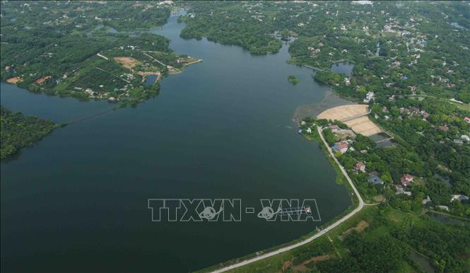 Một góc hồ thuỷ lợi Đồng Sương thuộc xã Trần Phú, huyện Chương Mỹ. Ảnh: Vũ Sinh – TTXVN Hà Nội nâng cao hiệu quả công trình thủy lợi phục vụ sản xuất nông nghiệp ảnh 4