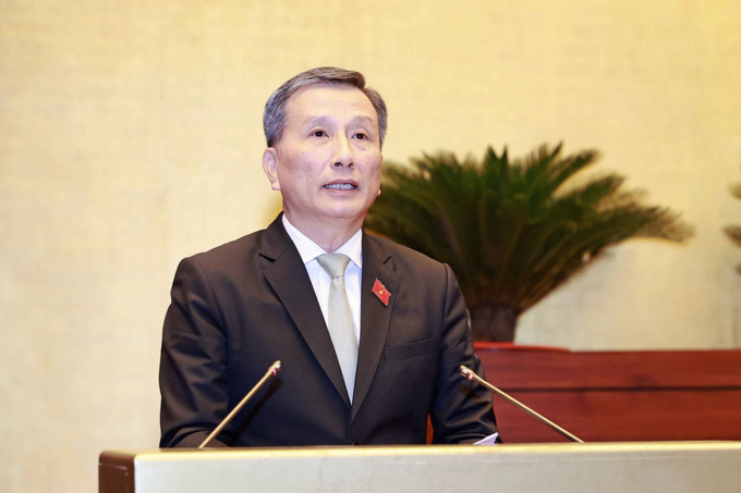 Chủ nhiệm Ủy ban Khoa học, Công nghệ và Môi trường của Quốc hội Lê Quang Huy trình bày Báo cáo thẩm tra về quyết định chủ trương đầu tư Dự án đường giao thông... Ảnh: Doãn Tấn – TTXVN Kỳ họp thứ 5, Quốc hội khóa XV: Tạo động lực phát triển kinh tế - xã hội khu vực miền núi tỉnh Khánh Hòa ảnh 2