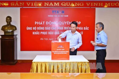 TTXVN ủng hộ đồng bào các tỉnh Tây Bắc khắc phục thiệt hại do mưa lũ