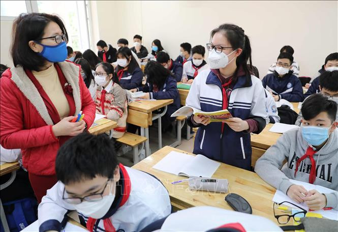 Học sinh lớp 9 trường THCS Ngọc Lâm, quận Long Biên (Hà Nội) học trực tiếp. Ảnh: Thanh Tùng - TTXVN 