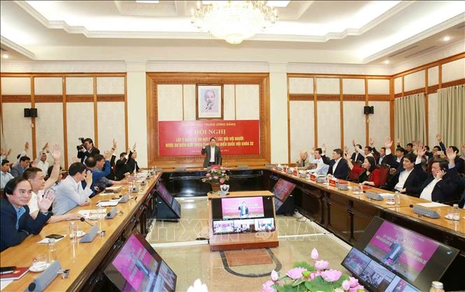 Đại biểu dự hội nghị biểu quyết giới thiệu người ứng cử đại biểu Quốc hội khóa XV. Ảnh: Phương Hoa - TTXVN