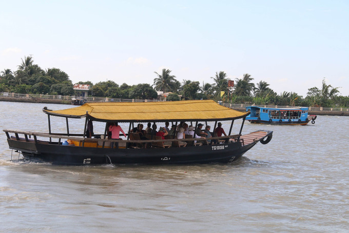 Các tour du lịch tham quan sông nước Tiền Giang luôn hấp dẫn du khách. Ảnh : Minh Trí - TTXVN Du lịch Tiền Giang phục hồi mạnh mẽ sau đại dịch ảnh 1