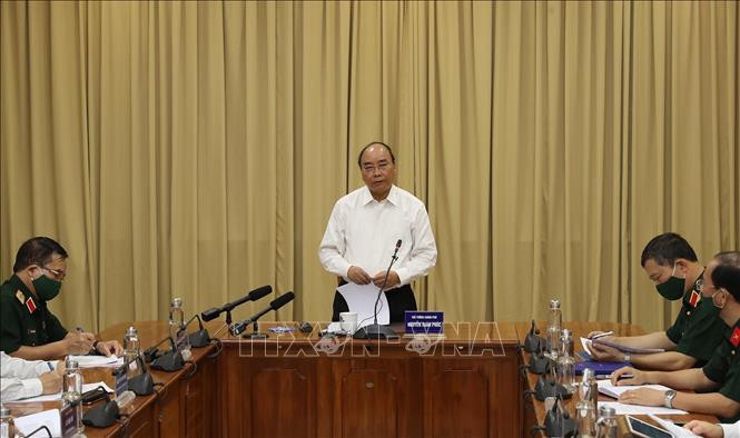 Thủ tướng Nguyễn Xuân Phúc chỉ đạo buổi làm việc với các bộ, ngành và Ban Quản lý Lăng Chủ tịch Hồ Chí Minh. Ảnh: Lâm Khánh – TTXVN Thủ tướng Chính phủ đồng ý mở cửa trở lại đón khách vào Lăng viếng Bác từ 15/8 ảnh 2