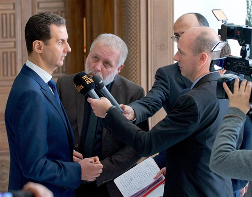Tổng thống Syria Bashar al-Assad trả lời phỏng vấn báo chí. EPA/ TTXVN