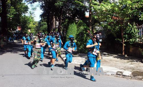 Các chiến sỹ lực lượng vũ trang Thành phố Hồ Chí Minh tham gia cuộc thi chạy 3.000 mét có trang bị phòng hóa tại Hội thao phòng Hóa sáng 26/7/2018. Ảnh: Xuân Khu-TTXVN Các chiến sỹ lực lượng vũ trang Thành phố Hồ Chí Minh tham gia cuộc thi chạy 3.000 mét có trang bị phòng hóa tại Hội thao phòng Hóa sáng 26/7/2018. Ảnh: Xuân Khu-TTXVN