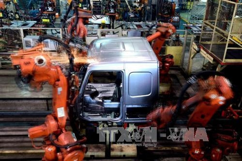 Hoạt động sản xuất tại nhà máy ở Tế Nam, thủ phủ tỉnh Sơn Đông, miền đông Trung Quốc ngày 17/6/2015. THX/TTXVN