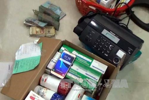 Tang vật được lực lượng chức năng thu giữ từ các điểm thầu đề. Ảnh: Tuấn Anh-TTXVN Phát