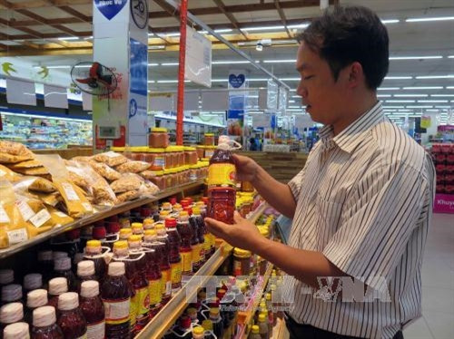 Sản phẩm nước mắm Cửa Khe ở siêu thị Co.opmart Tam Kỳ. Ảnh : Đỗ Trưởng- TTXVN Sản phẩm nước mắm Cửa Khe ở siêu thị Co.opmart Tam Kỳ. Ảnh : Đỗ Trưởng- TTXVN