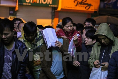 Cảnh tượng chen nhau không phải là hiếm. (Ảnh: Minh Sơn/Vietnam+)