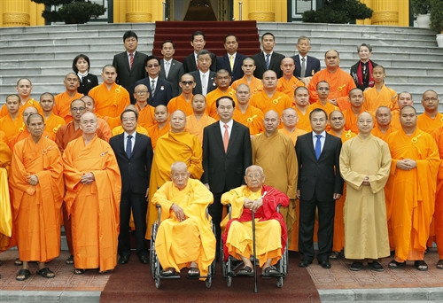 Chủ tịch nước Trần Đại Quang với các đại biểu tham dự buổi tiếp. Ảnh: Nhan Sáng-TTXVN