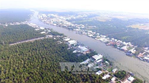 Một góc cù lao Tắc Cậu bên dòng sông Cái Bé, xã Bình An, huyện Châu Thành, Kiên Giang. Ảnh: Mạnh Linh-TTXVN