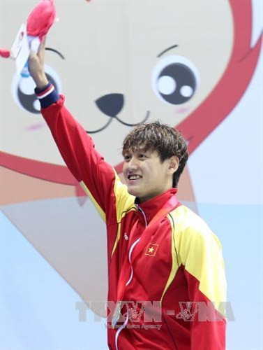 Hoàng Quý Phước với chiếc HCV trong ngày thi đấu 6/6. Ảnh: Quốc Khánh/TTXVN