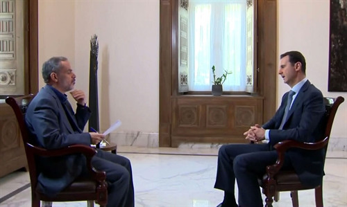 Tổng thống Syria Bashar al-Assad ( phải), Ảnh: AFP/TTXVN