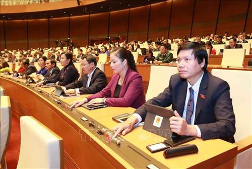 Đại biểu Quốc hội ấn nút thông qua Nghị quyết. Ảnh: Doãn Tấn – TTXVN Đại biểu Quốc hội ấn nút thông qua Nghị quyết. Ảnh: Doãn Tấn – TTXVN