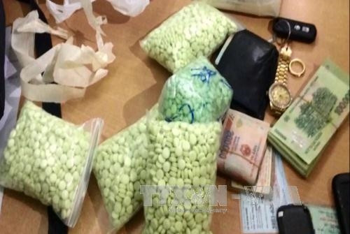 Tang vật tiền được thu giữ. Ảnh: Tuấn Anh-TTXVN