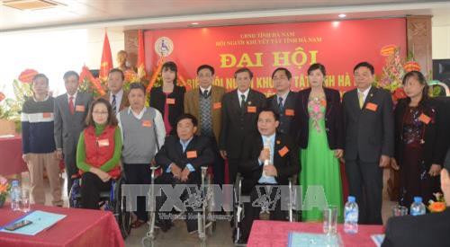 Ban Chấp hành Hội Người khuyết tật tỉnh Hà Nam nhiệm kỳ 2017 – 2022 ra mắt Đại hội. Ảnh: Nguyễn Chinh - TTXVN. Ban Chấp hành Hội Người khuyết tật tỉnh Hà Nam nhiệm kỳ 2017 – 2022 ra mắt Đại hội. Ảnh: Nguyễn Chinh - TTXVN.