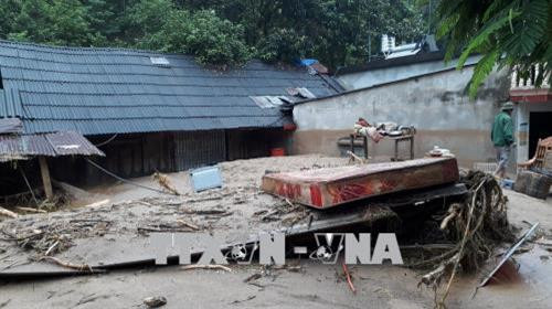 Nhiều ngôi nhà ở xã Sơn Lương, huyện Văn Chấn bị ảnh hưởng do lũ. Ảnh Tuấn Anh - TTXVN