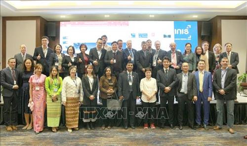 Các đại biểu dự hội nghị chụp ảnh chung. Ảnh: Trung Nguyên-TTXVN