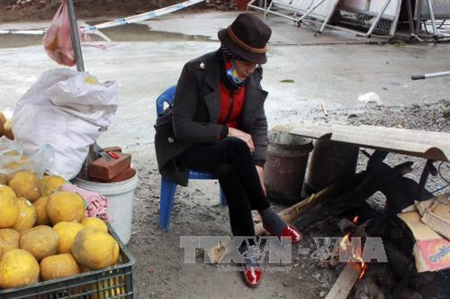 Người lao động Hà Nội trong đợt giá rét kỷ lục của mùa đông ảnh 7