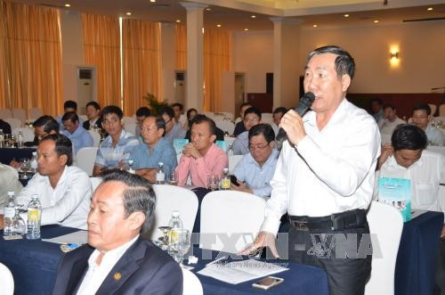 Ông Ngô Toàn, đại diện cho các doanh nghiệp trồng cao su phát biểu tại cuộc tọa đàm. Ảnh: Trần Chí Hùng-Phóng viên TTXVN tại Campuchia.