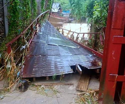 Lũ quét làm sập cầu treo xã Bản Hồ (Lào Cai). Ảnh: Bùi Cương Quyết - TTXVN Lũ quét làm sập cầu treo xã Bản Hồ (Lào Cai). Ảnh: Bùi Cương Quyết - TTXVN