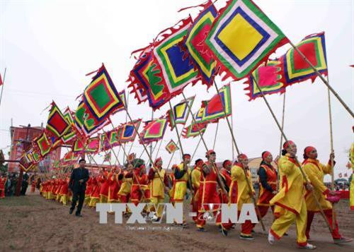 Nghi thức rước tại lễ hội. Ảnh: Quý Trung - TTXVN