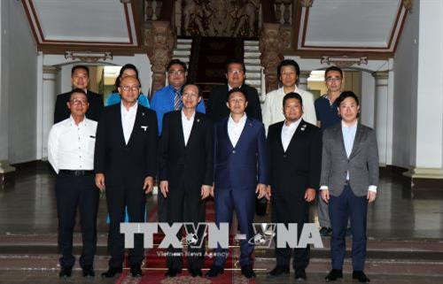 Các đại biểu chụp ảnh chung sau buổi tiếp. Ảnh: Xuân Khu-TTXVN