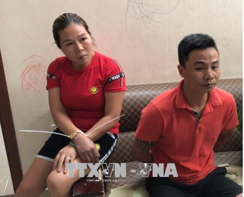 Đối tượng cầm đầu Nguyễn Văn Bình (phải). Ảnh: TTXVN phát