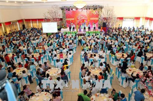 Quang cảnh bữa cơm tất niên của công nhân với lãnh đạo Thành phố Hồ Chí Minh. Ảnh: Thanh Vũ-TTXVN