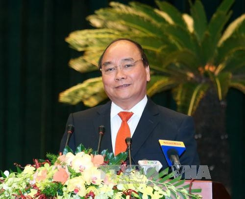 Thủ tướng Nguyễn Xuân Phúc đến dự và phát biểu tại Hội nghị Người Việt Nam ở nước ngoài trên thế giới năm 2016 với chủ đề “Kiều bào chung sức xây dựng thành phố Hồ Chí Minh phát triển nhanh, bền vững và hội nhập quốc tế”. Ảnh: Thống Nhất-TTXVN