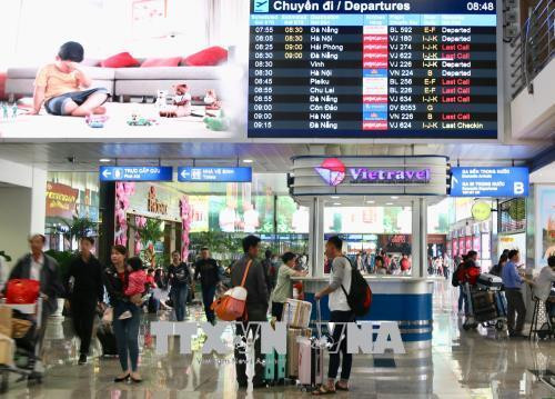 Nhiều chuyến bay đi từ sân bay Tân Sơn Nhất trong ngày 11/2 (26 Tết). Ảnh Trần Xuân Tình-TTXVN