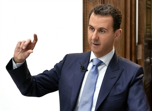 Trong ảnh (tư liệu): Tổng thống Syria Bashar al-Assad trả lời phỏng vấn báo chí ở Damascus ngày 3/4. EPA/TTXVN