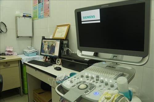Trạm Y tế Phường 13, quận Bình Thạnh được trang bị máy siêu âm hiện đại. Ảnh: Đinh Hằng - TTXVN Trạm Y tế Phường 13, quận Bình Thạnh được trang bị máy siêu âm hiện đại. Ảnh: Đinh Hằng - TTXVN