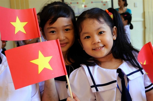 Nụ cười tuổi thơ. Ảnh: TTXVN Nụ cười tuổi thơ. Ảnh: TTXVN