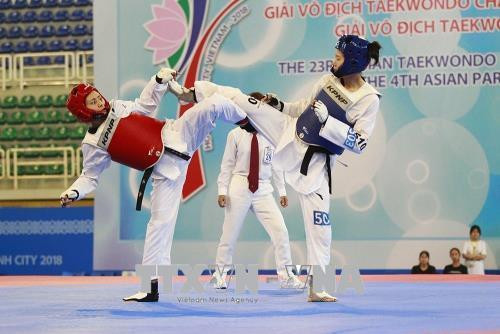 Vận động viên Lâm Thị Hà Thanh của Việt Nam (áo giáp đỏ) thi đấu đối kháng tại giải. Ảnh: Xuân Dự - TTXVN Vận động viên Lâm Thị Hà Thanh của Việt Nam (áo giáp đỏ) thi đấu đối kháng tại giải. Ảnh: Xuân Dự - TTXVN