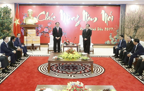 Chủ tịch nước Trần Đại Quang thăm, chúc Tết các đồng chí lãnh đạo Thành ủy, Hội dồng nhân dân, Ủy ban nhân dân Thành phố Hà Nội. Ảnh: Nhan Sáng-TTXVN