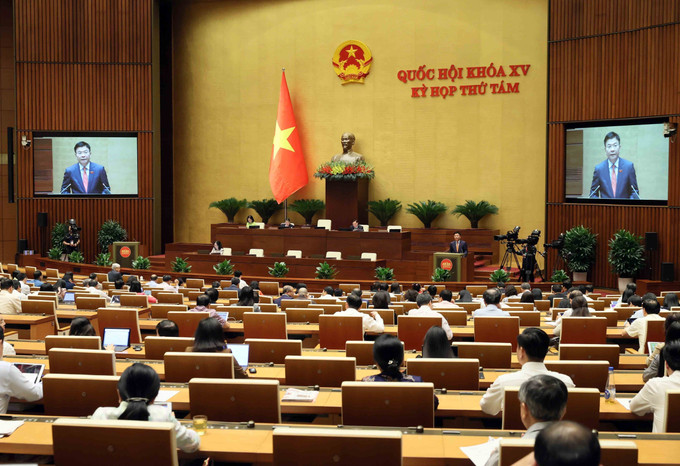 Phó Thủ tướng Lê Thành Long trình bày Tờ trình về dự án Luật Thuế thu nhập doanh nghiệp (sửa đổi). Ảnh: An Đăng - TTXVN dsdf.jpg