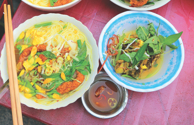 Bún cá Châu Đốc là món ăn đặc sản nổi tiếng với hương vị thơm ngon đặc biệt. Ảnh: Công Mạo Bun ca Chau Doc 1.jpg