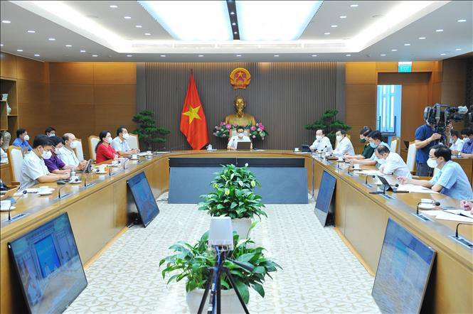 Quang cảnh cuộc họp trực tuyến. Ảnh: Minh Đức - TTXVN Dịch COVID-19: Triển khai robot gọi điện hỏi thăm sức khỏe để kịp thời lấy mẫu xét nghiệm cho người dân Thành phố Hồ Chí Minh ảnh 1