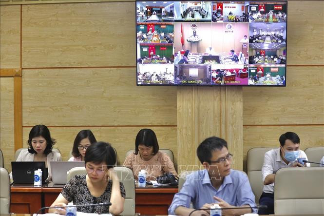 Điểm cầu trực tuyến tại các tỉnh, thành phố. Ảnh: Minh Quyết - TTXVN Dịch COVID-19: Hệ thống đảm bảo an toàn tiêm chủng được thiết lập trên toàn quốc ảnh 4