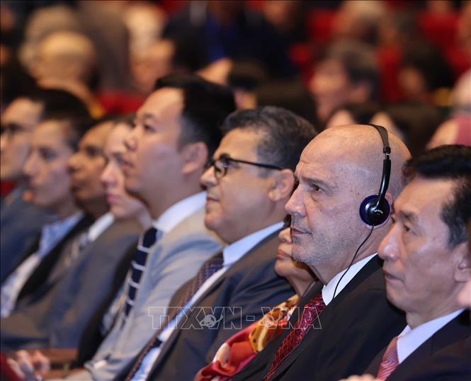 Các đại biểu quốc tế tham dự Lễ kỷ niệm. Ảnh: Thống Nhất – TTXVN Kỷ niệm trọng thể 90 năm Ngày thành lập Mặt trận Dân tộc Thống nhất Việt Nam - Ngày truyền thống Mặt trận Tổ quốc Việt Nam ảnh 5