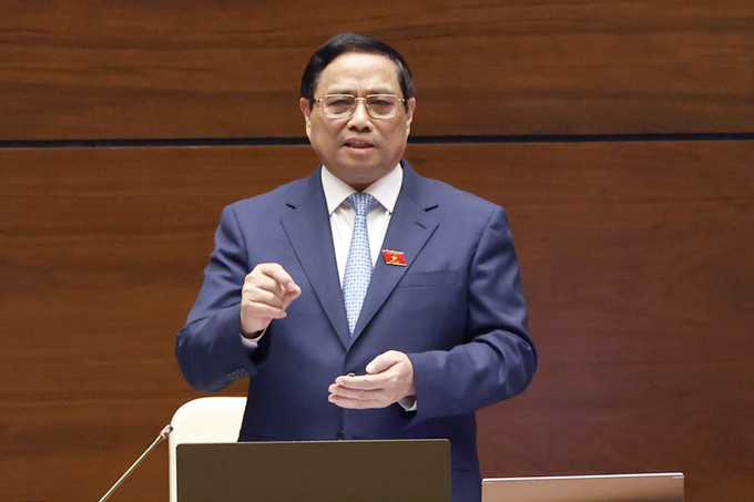 Thủ tướng Chính phủ Phạm Minh Chính trả lời chất vấn. Ảnh: Doãn Tấn - TTXVN Kỳ họp thứ 6, Quốc hội khóa XV: Thực hiện cải cách tiền lương cho cả khu vực trong và ngoài nhà nước ảnh 2