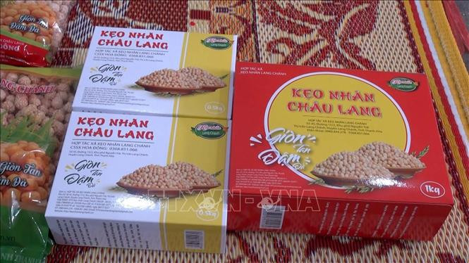 Kẹo nhãn Lang Chánh. Ảnh: Nguyễn Nam-TTXVN Làng nghề truyền thống kẹo nhãn Lang Chánh tăng sản xuất cho Tết ảnh 5