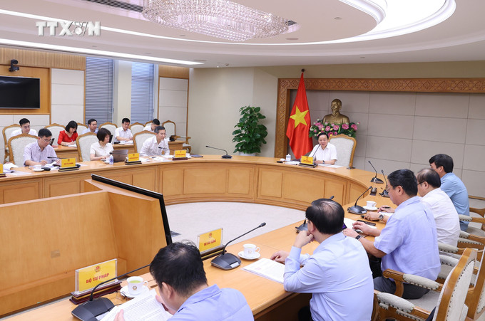 Cuộc họp nghe báo cáo về Dự án Luật Địa chất và Khoáng sản. Ảnh: Văn Điệp - TTXVN vna_potal_pho_thu_tuong_tran_hong_ha_hop_ve_du_an_luat_dia_chat_va_khoang_san_7556521.jpg