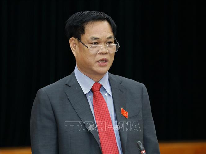 Đồng chí Huỳnh Tấn Việt, Ủy viên Trung ương Đảng, Bí thư Đảng ủy Khối các cơ quan Trung ương trả lời các câu hỏi của phóng viên tại buổi họp báo. Ảnh: Văn Điệp – TTXVN