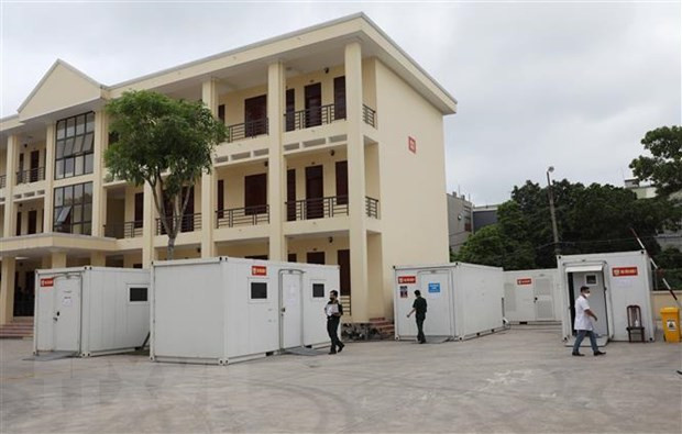 Test nhanh kháng nguyên trong container tại Trung tâm xét nghiệm lưu động Bắc Giang. Ảnh: Danh Lam - TTXVN Bắc Giang: Giãn cách xã hội toàn thành phố Bắc Giang để phòng, chống dịch COVID-19 ảnh 1